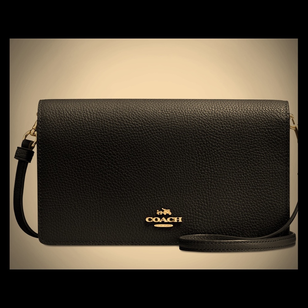Never used leather coach clutch/wristlet.